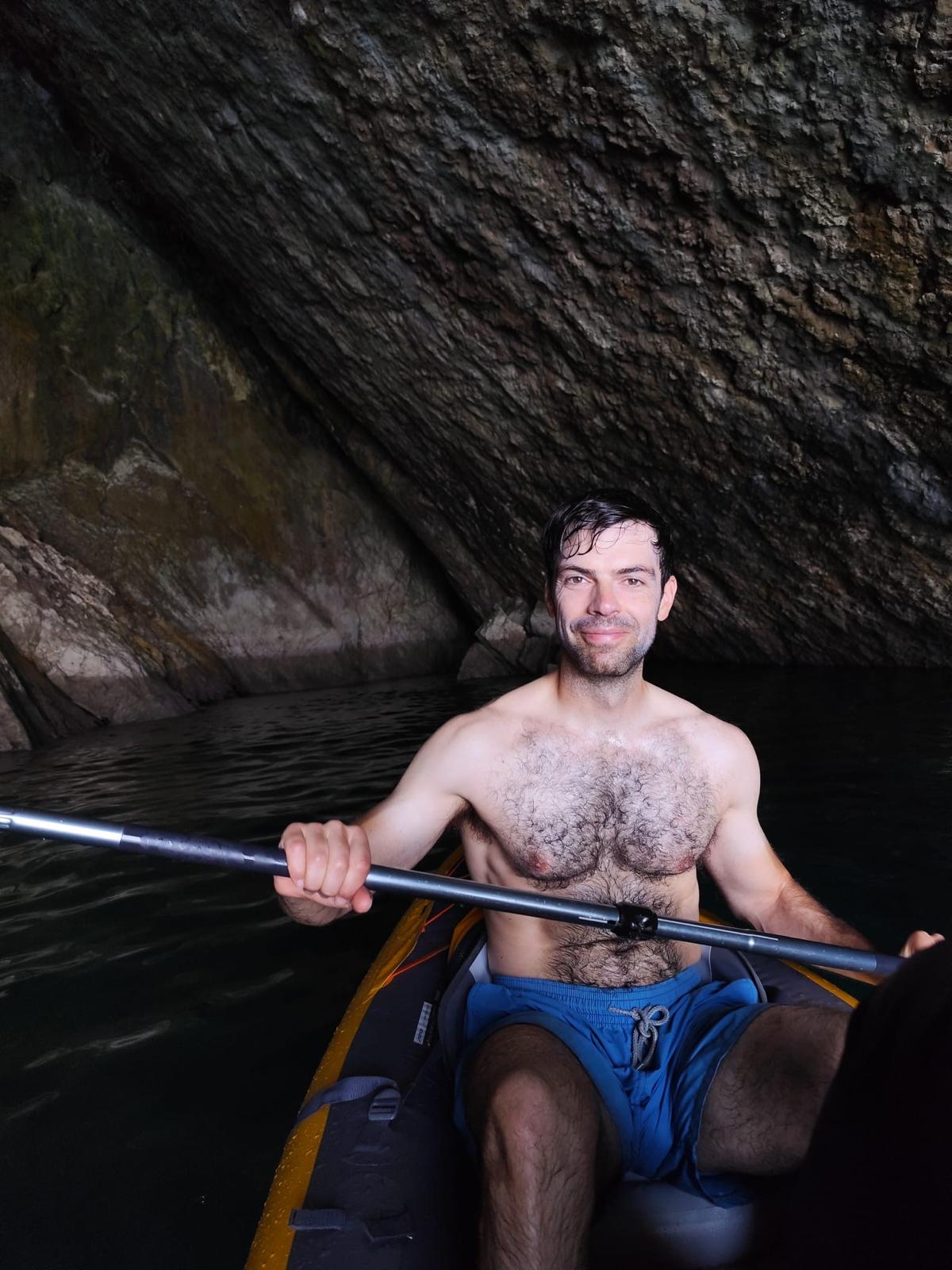 Francisco B. Sousa kayaking inside a sea cave